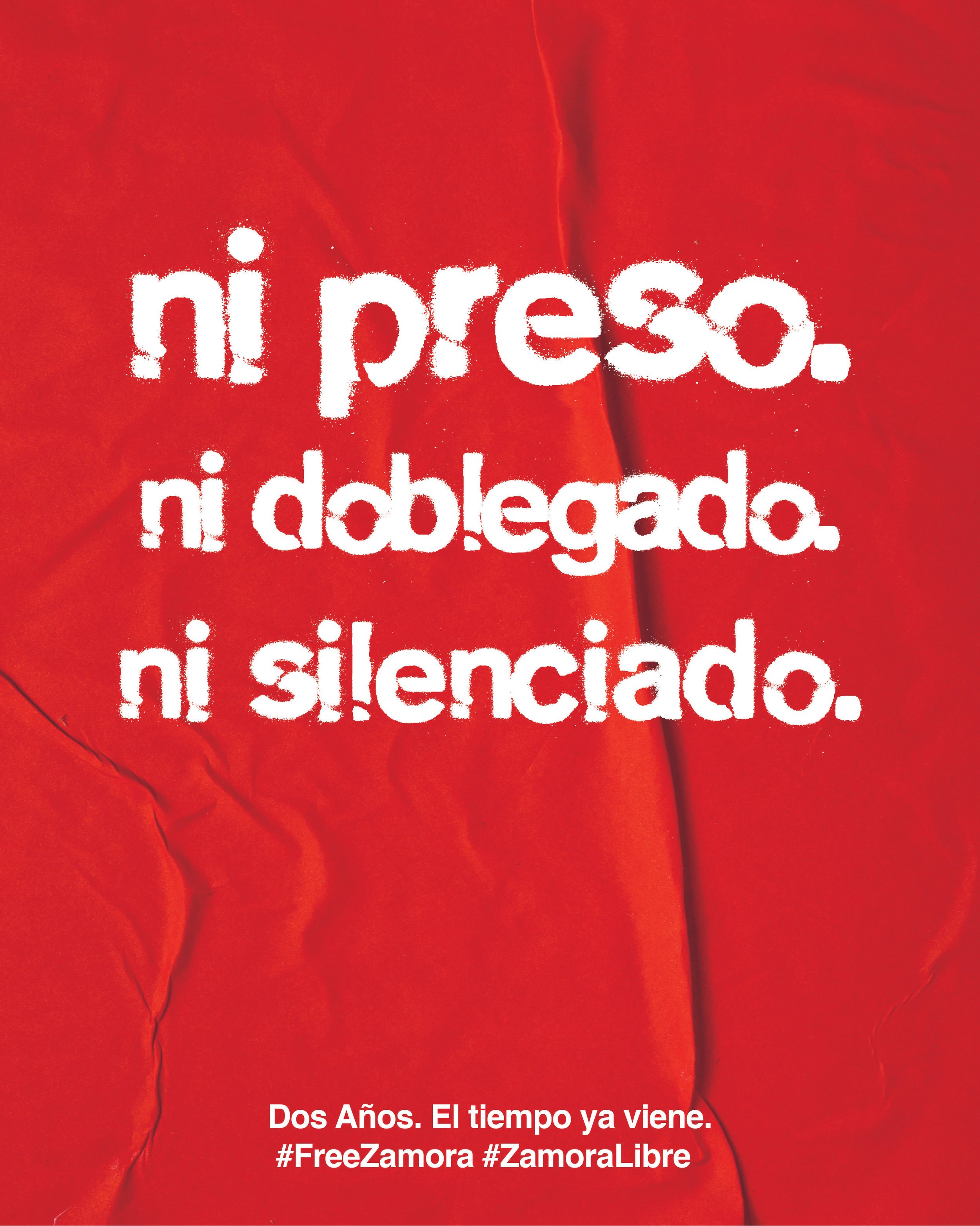 Gráfico de campaña sobre papel rojo: «ni preso. ni doblegado. ni silenciado», en letras blancas, con la firma «Dos años. El tiempo ya viene. #FreeZamora #ZamoraLibre».